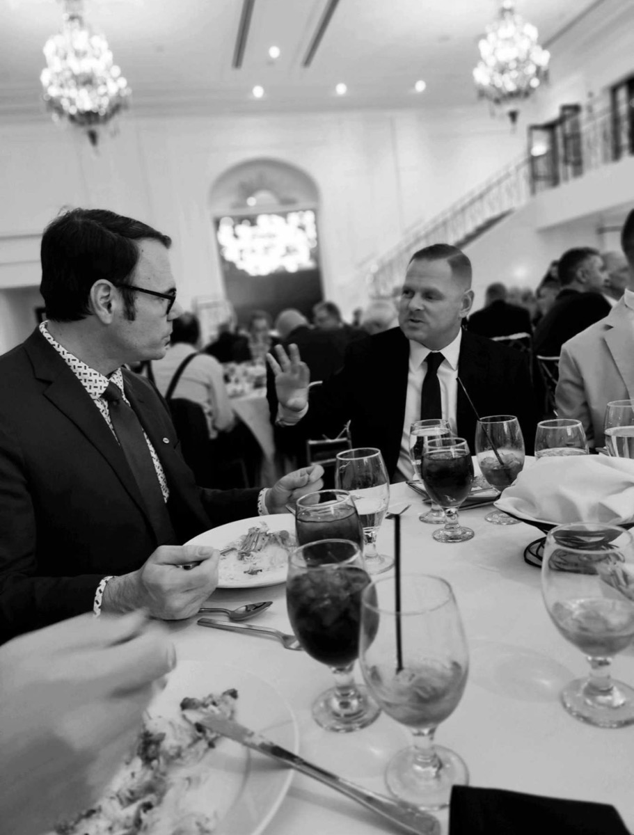 George Ricciardella in conversation at a fundraising event